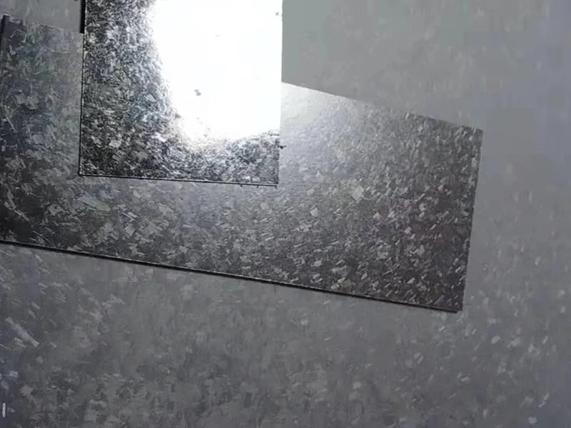 Irregular mottled carbon-fiber surface on composite plate samples