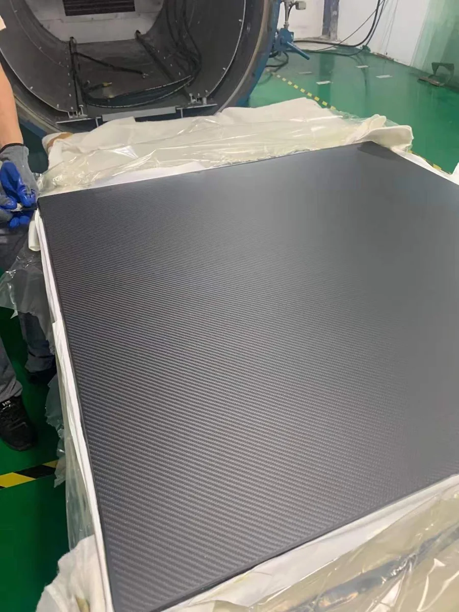 Factory-supplied dark woven carbon-fiber sheet