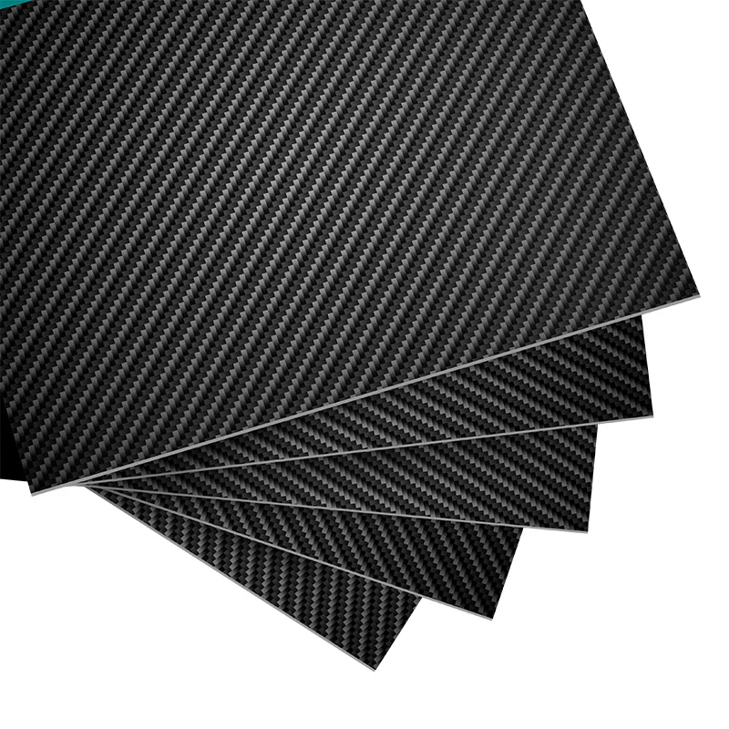 Several dark carbon fiber panels with a visible woven surface